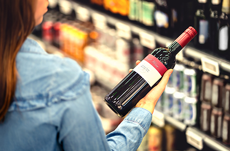 woman holding a wine bottle