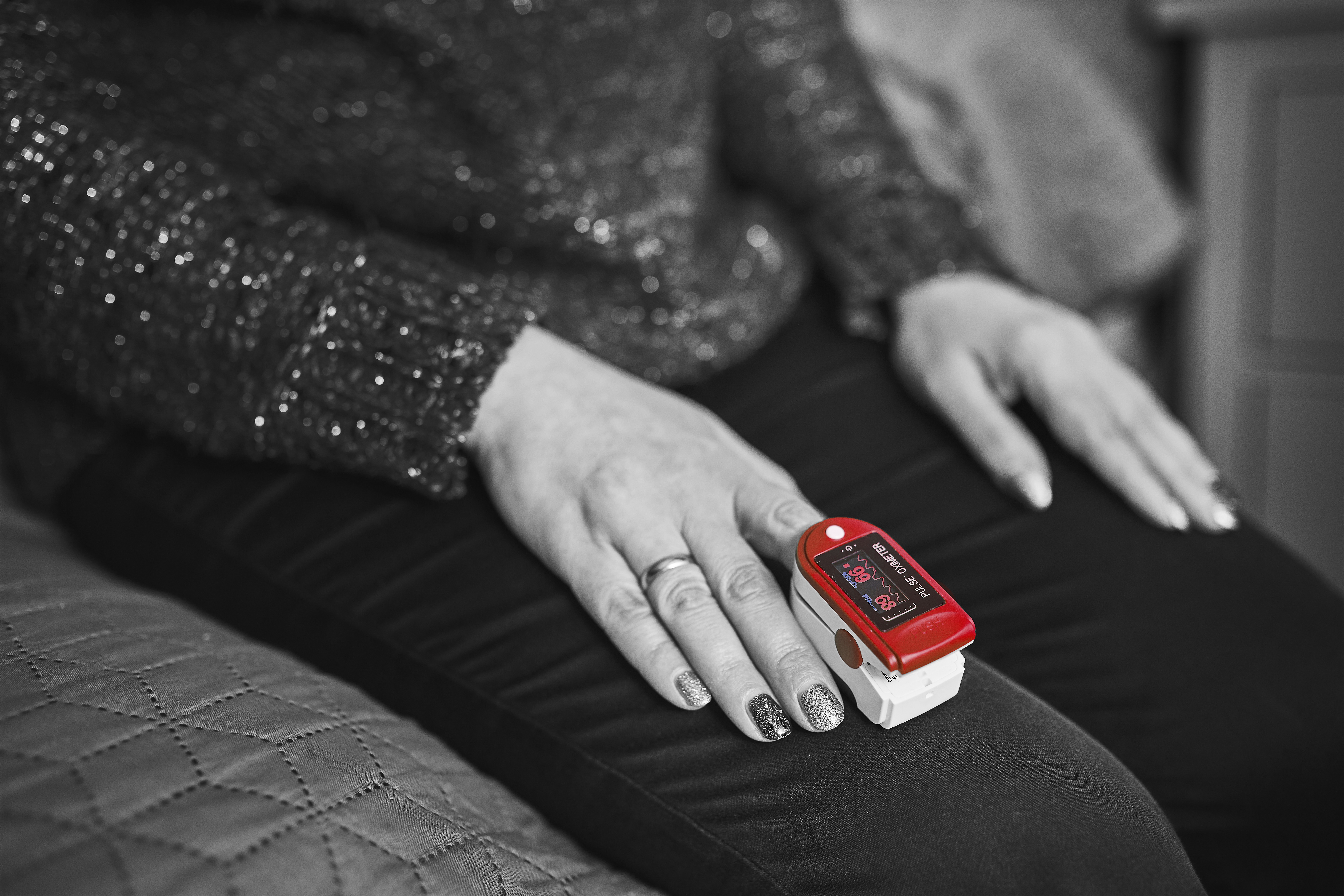 Woman with a heart rate monitor on her finger