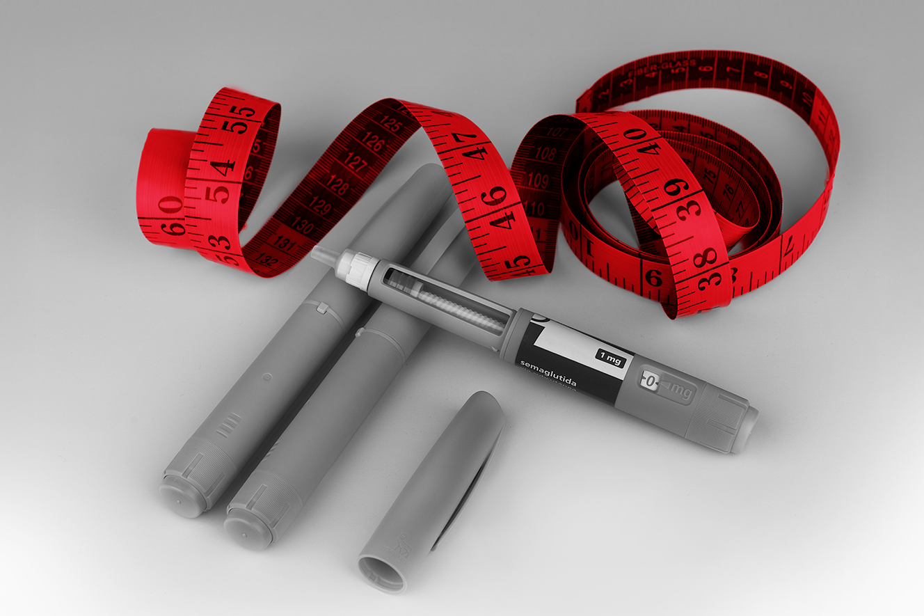 GLP-1 shots with a red tape measure