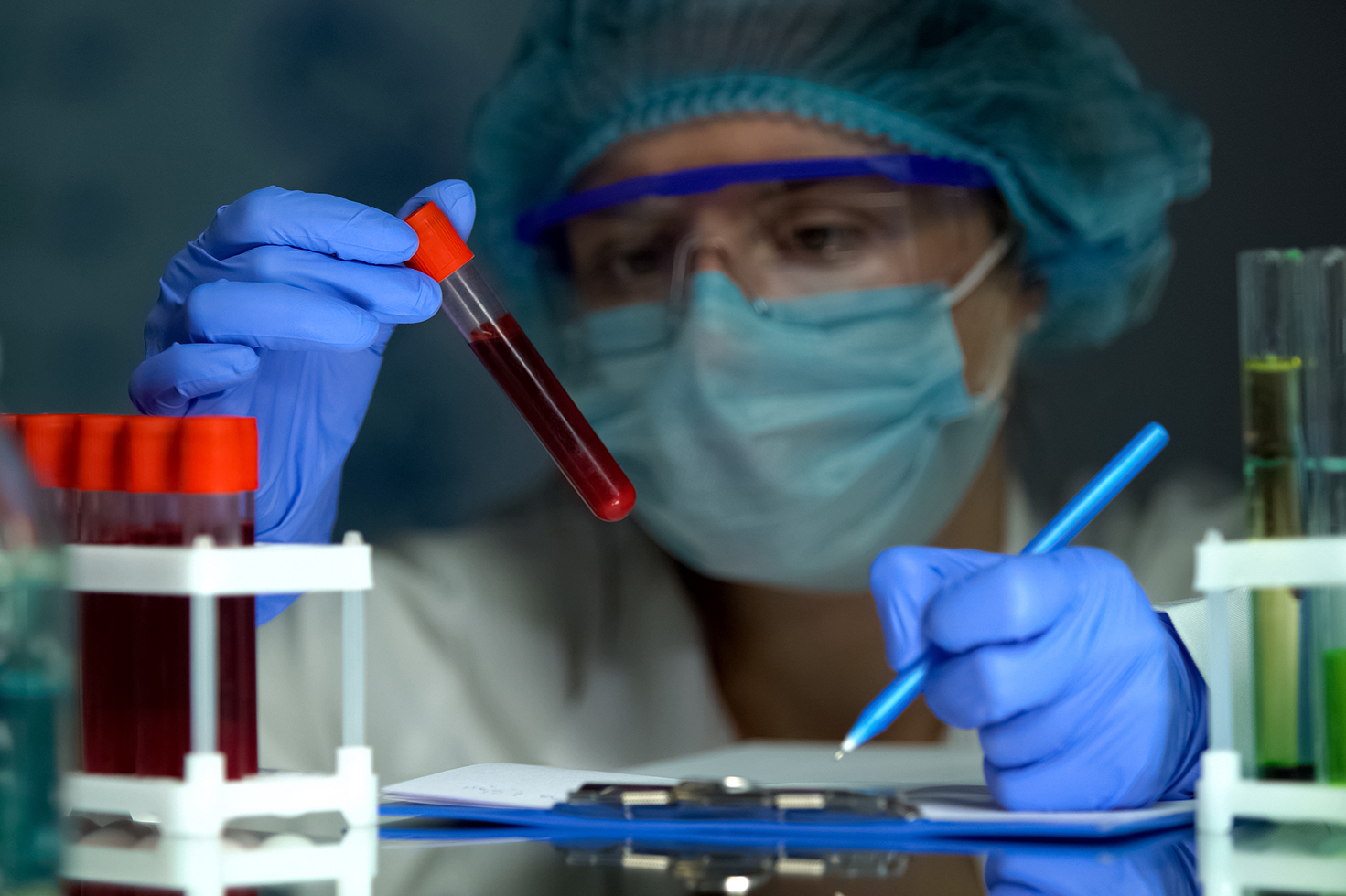 Doctor looking at blood sample