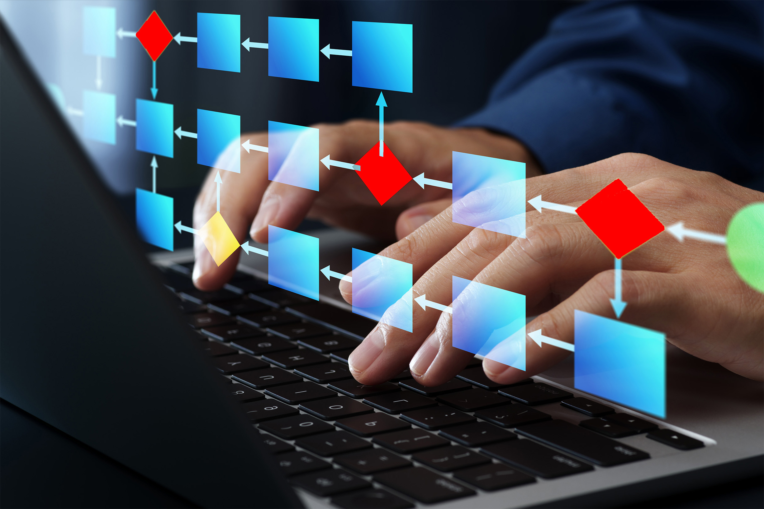 Fingers typing a workflow