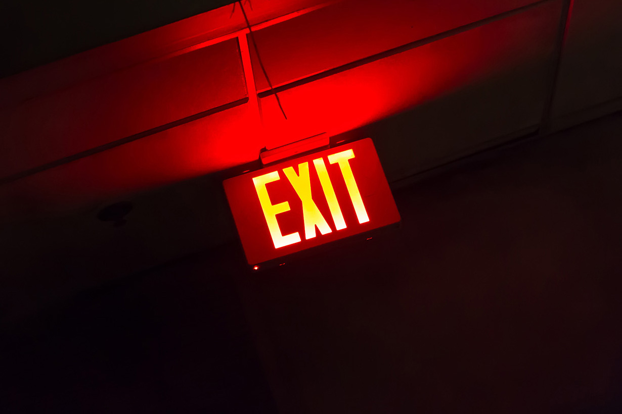 Red illuminated exit sign
