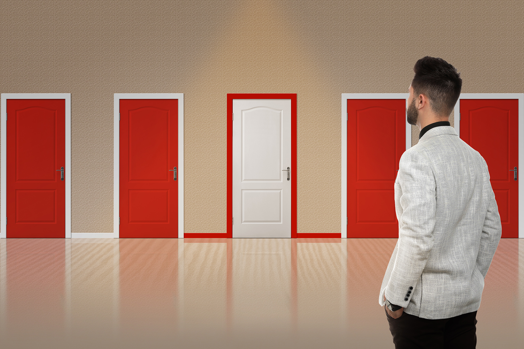 A man considering what door to enter.