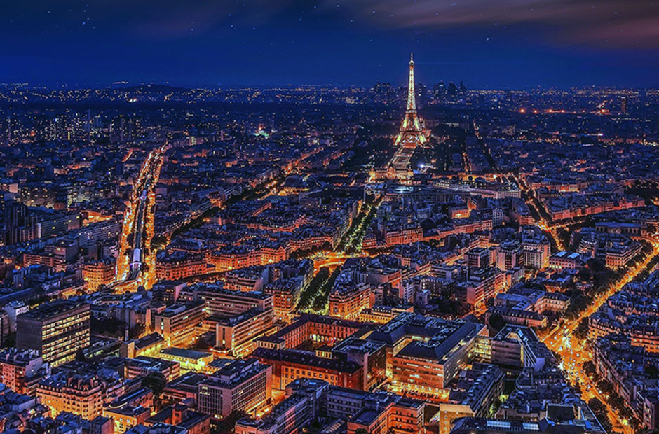 An aerial view of the glowing vibrant city of Paris