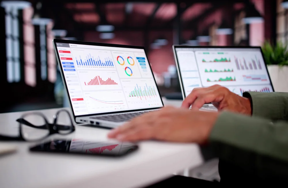 Woman Looking at Analytics Dashboard  on Her Laptop