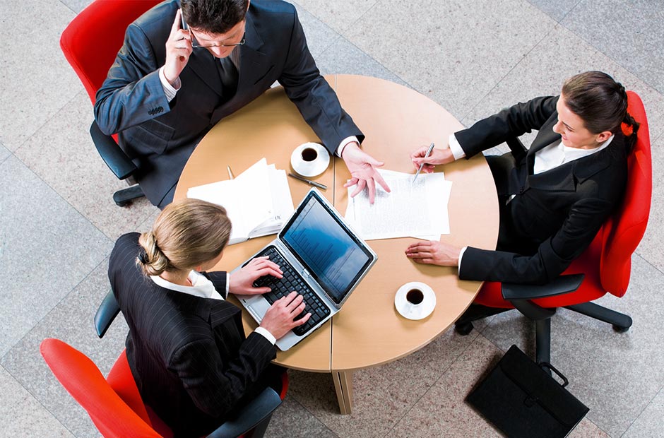 3 business people meeting at a round table