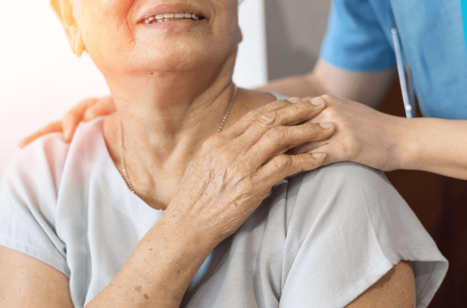Caregiver assisting elderly woman