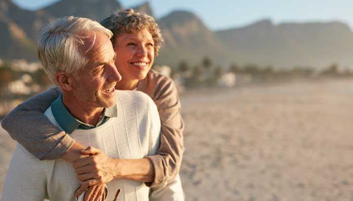 Pension annuitants walking on the beach