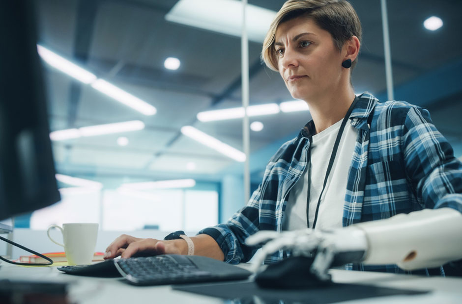 A woman with a disability returns to work after undergoing rehabilitation