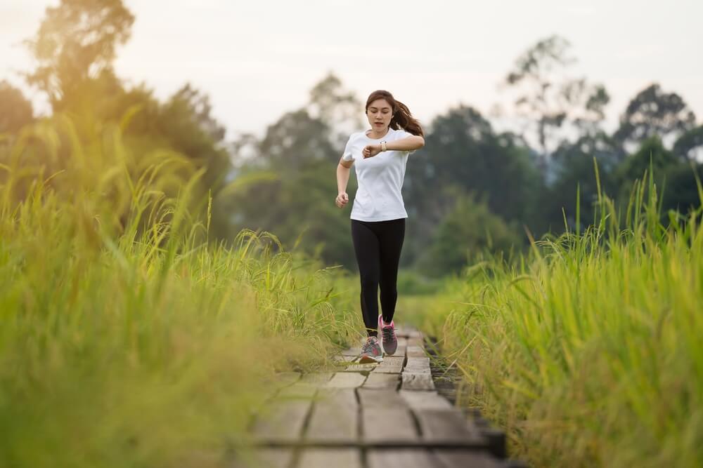 A jogger races along an empty trail