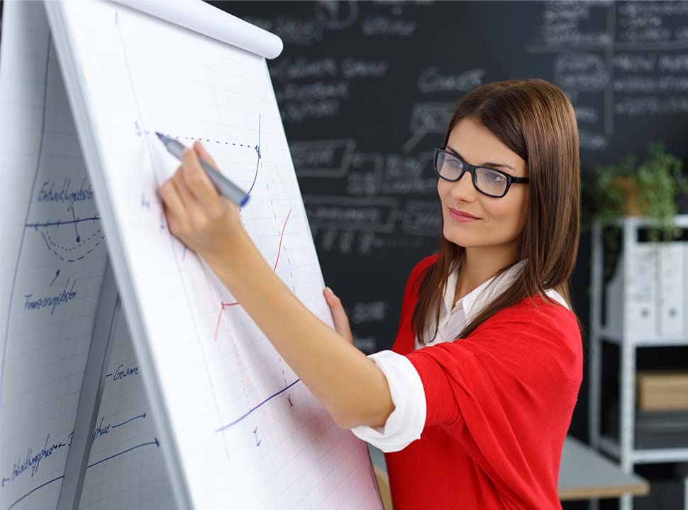 Woman with Glasses and a Red Shirt Drawing and Analyzing a Graph