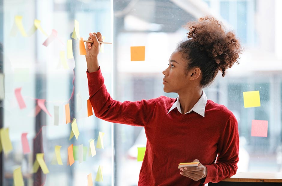 Woman In a Red Shirt Post-It-Note-Planning