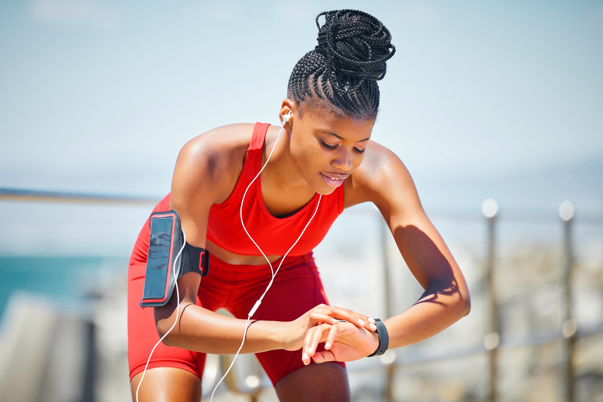 Woman Running Checking her Smart Watch