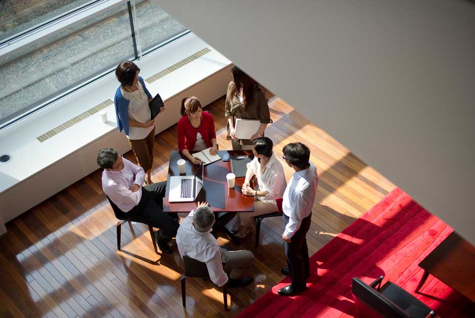 An overhead image of a group of professionals engaged in a training exercise