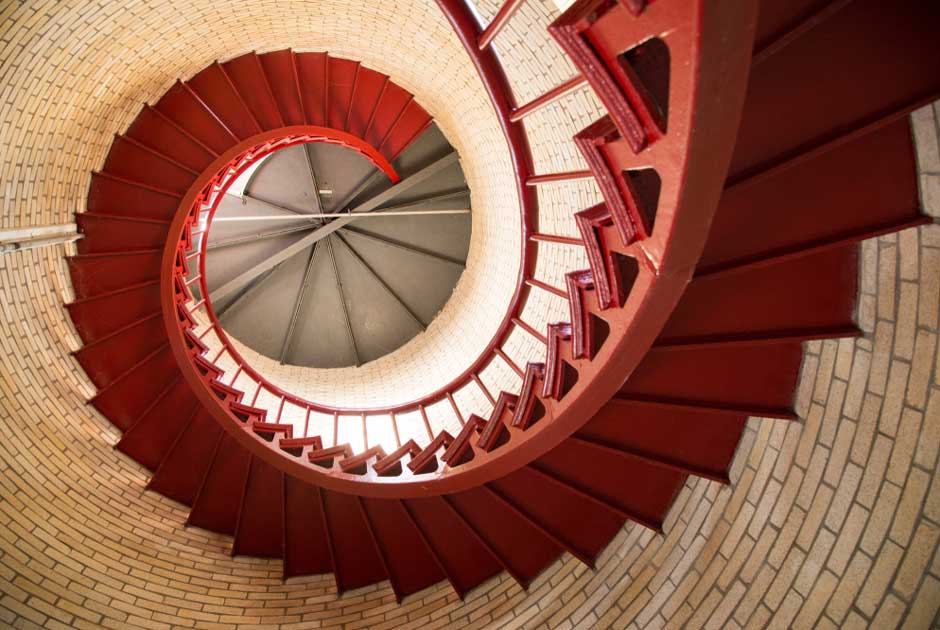 A curved set of red stairs speak to Pathfinder claims training and the ability to guide visitors down challenging paths