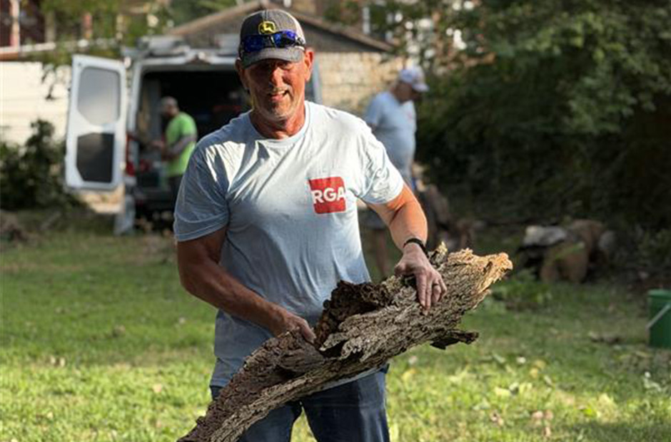 RGA-Employee-Carrying-Bark-at-Rebuilding-Together