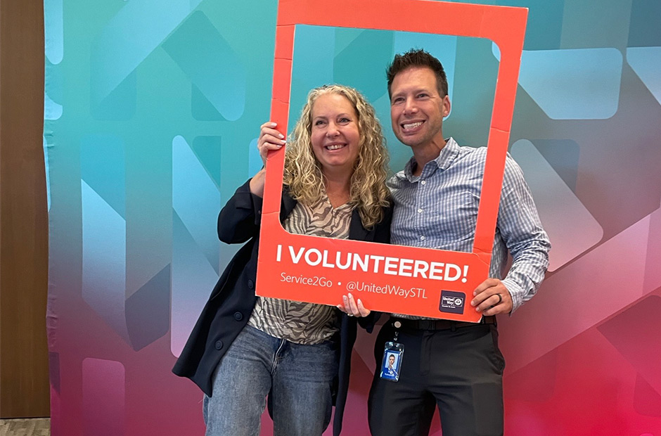 Two RGA Employees Pose for a Picture at the United Way Event