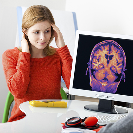Woman looking at a brain scan