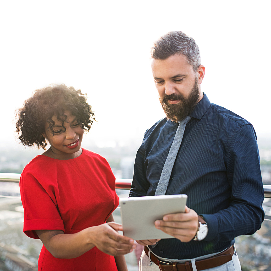 Two people looking at an ipad