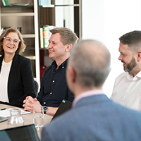 People sitting at conference table