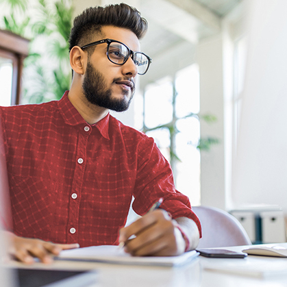 Man reading report on his computer