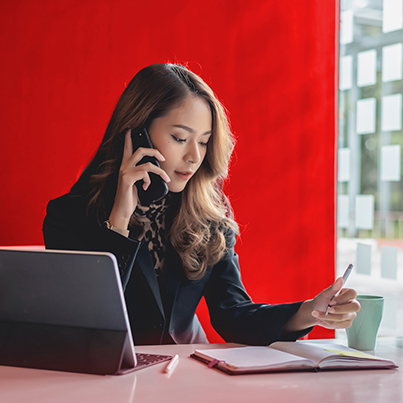 Woman on the phone making an appointment