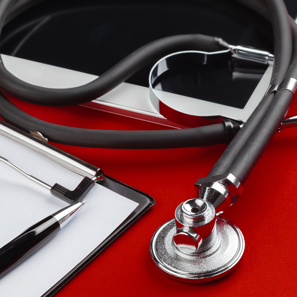 A stethoscope, tablet and clipboard
