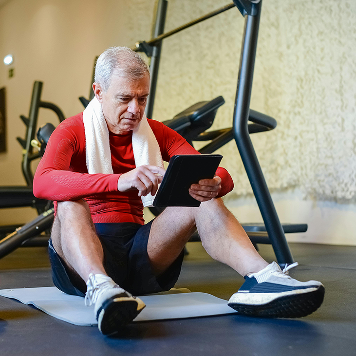 Man sitting on the floor during a workout