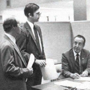 Historical image of earliest employees of the entity that will become RGA, including future CEO Greig Woodring