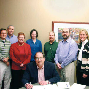 Deal signing marking acquisition of reinsurance business of Allianz Life