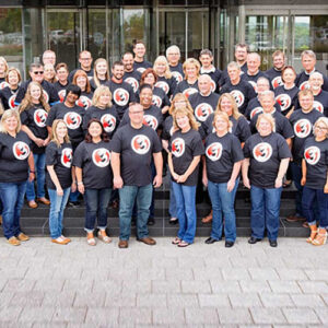 Group shot of U.S. team celebrating 3 millionth facultative case received