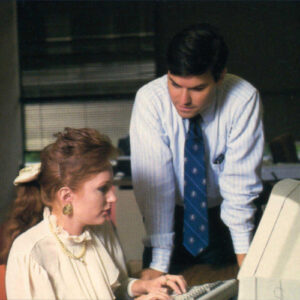 Image from the 1980s of RGA employees digitizing administrative tasks