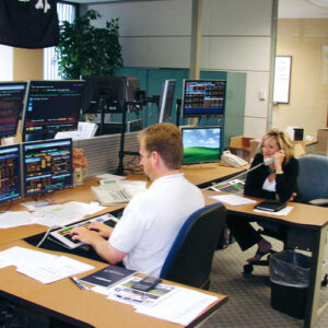 Historical image of investment team at a bond trading desk