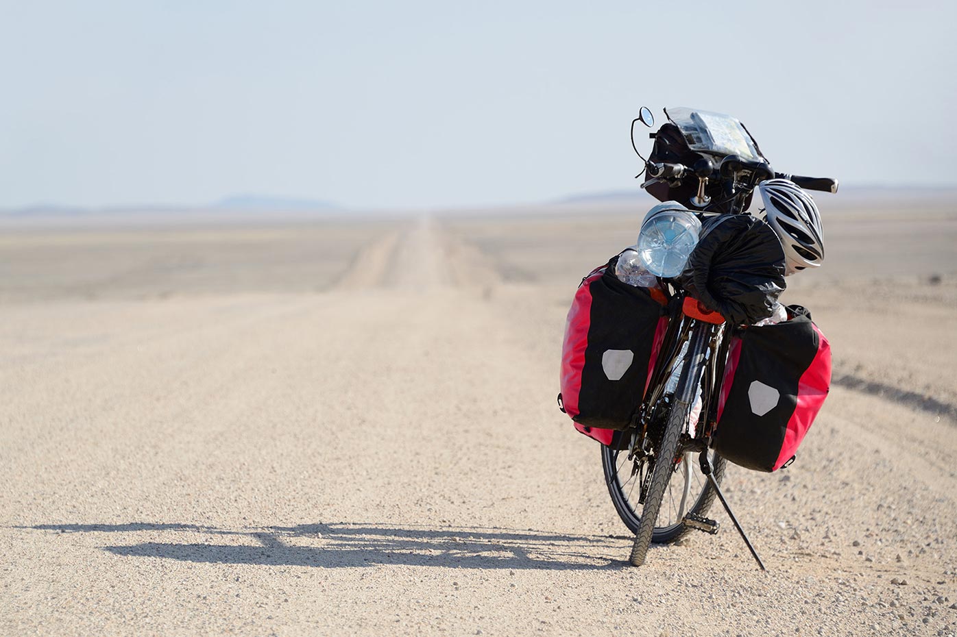 motorbike on side of dirt road in the desert